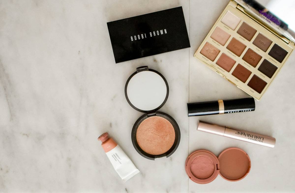 Infographic showing average makeup collection size vs. usage frequency, with color-coded categories like 'daily essentials,' 'special occasion,' and 'expired/unused'